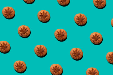 chip cookies with marijuana isolated on turquoise background. pattern