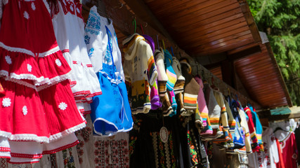 Old, vintage embroidered shirts for sale at the flea market, Sinaia, Prahova County, Romania.