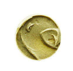 Texture and strokes of a light green organic mask for face or body cream isolated on white background