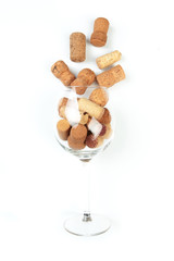 Wine corks in glass isolated on white background. Focus on wine corks - Image