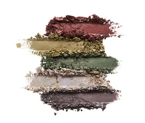 Broken eyeshadows in trendy shades isolated on white background