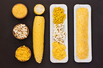 A set of products made from corn. Black background