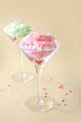 Glasses with tasty cotton candy on color background