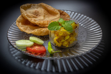 Puri Bhaji, Indian food served with Fried Aloo or Bhaji.