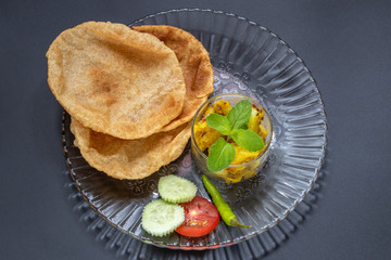 Puri Bhaji, Indian food served with Fried Aloo or Bhaji.