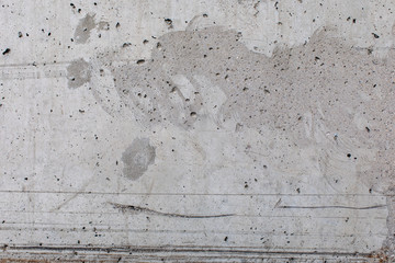 Concrete wall with stains and cracks