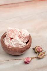 Turkish delights and edible roses on table