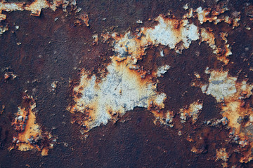 Rusty metal surface with blue paint residue as background image