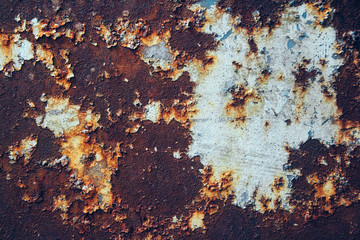Rusty metal surface with blue paint residue as background image
