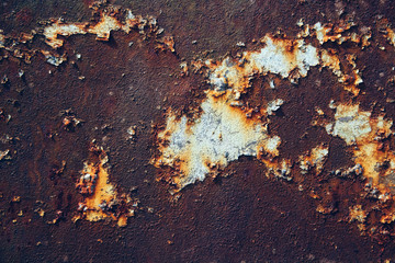 Rusty metal surface with blue paint residue as background image