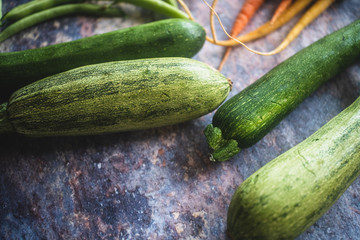 closeup of green zucchini with other vegetables