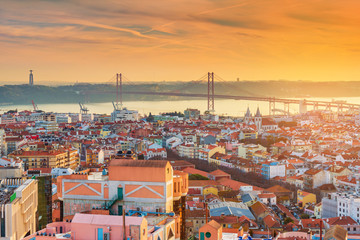 Fototapeta premium Picturesque sunset over Lisbon, Portugal. Evening panorama of the Portuguese capital city