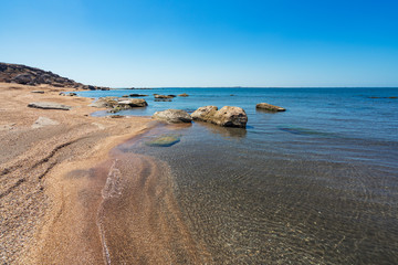 Fototapeta na wymiar Rock fragments on the ocean shore