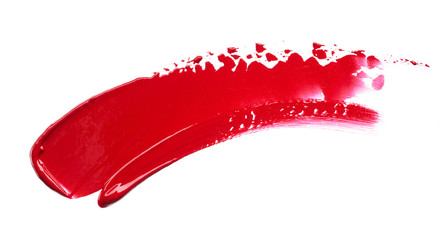 Smear and texture of red lipstick or acrylic paint isolated on white background.