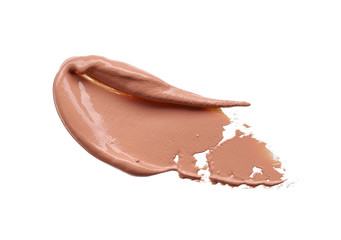 Gently beige strokes and texture of makeup foundation or acrylic paint isolated on white background