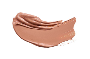 Gently beige strokes and texture of makeup foundation or acrylic paint isolated on white background