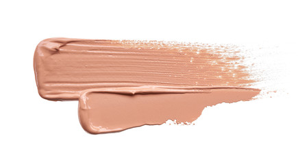 Gently beige strokes and texture of makeup foundation or acrylic paint isolated on white background