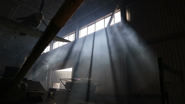 Rays of light pass through the windows of the building