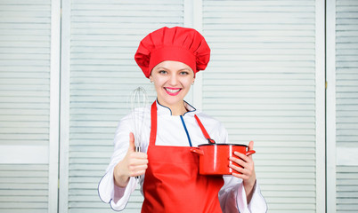Woman chef hold whisk and pot. Girl in apron whipping eggs or cream. Start slowly whisking or...