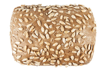Fresh dark roll with sunflower seeds on a white background.