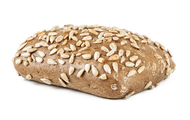 Fresh dark roll with sunflower seeds on a white background.