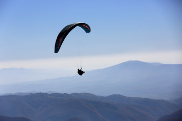 flying paraglider in air