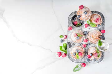 Fototapeta na wymiar Muffins or cupcakes with berries