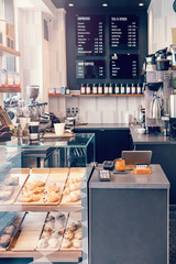 Interior design details of empty modern coffee shop restaurant at daytime. Small local business....