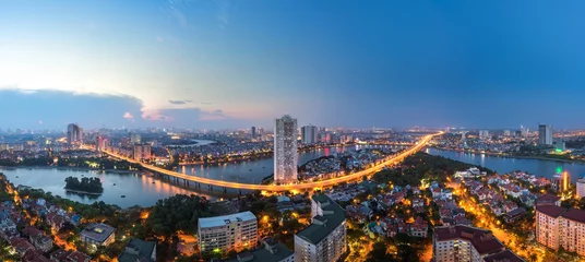 Tuinposter Aerial skyline view of Hanoi at Linh Dam lake, Belt Road No. 3. Hanoi cityscape by sunset period © Hanoi Photography