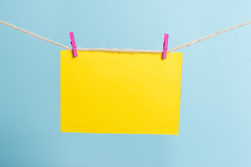 Clothesline clothespin rectangle shaped paper reminder white wood desk