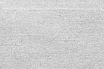 Cardboard white texture close-up. Light old paper background. Grunge concrete wall. Vintage blank wallpaper.