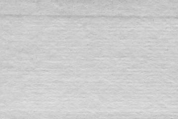 Cardboard white texture close-up. Light old paper background. Grunge concrete wall. Vintage blank wallpaper.