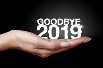 Goodbye 2019 with hand.