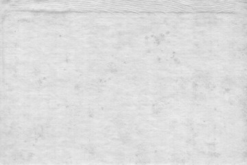 Cardboard white texture close-up. Light old paper background. Grunge concrete wall. Vintage blank wallpaper.
