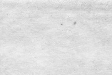 Cardboard white texture close-up. Light old paper background. Grunge concrete wall. Vintage blank wallpaper.