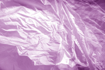 Plastic transparent old wrap texture in purple tone.