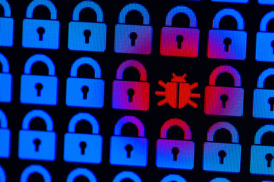 Bug as a symbol of malware and a Trojan virus in the program code. Hacking and theft of personal information and data. Blue pixel locks and red Bug on a black background, close-up