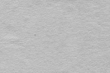 Cardboard white texture close-up. Light old paper background. Grunge concrete wall. Vintage blank wallpaper.