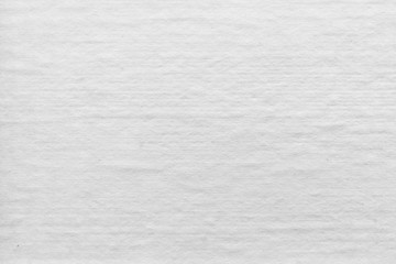 Cardboard white texture close-up. Light old paper background. Grunge concrete wall. Vintage blank wallpaper.