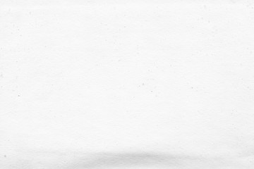 Cardboard white texture close-up. Light old paper background. Grunge concrete wall. Vintage blank wallpaper.