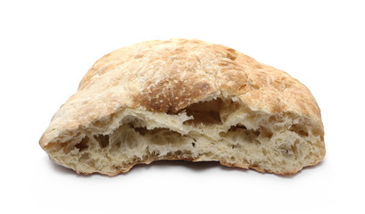 Loaf of wheat bread sliced in half isolated on white background