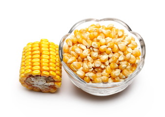 Yellow grain corn ear in glass bowl isolated on white background