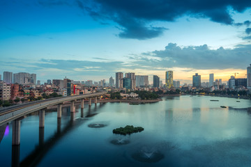 Fototapeta premium Aerial skyline view of Hanoi at Hoang Cau lake. Hanoi cityscape by sunset period