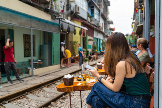 Railway Cafe. People Drink Coffee Waiting For Train To Arrive On Railway Road In Hanoi, Vietnam.