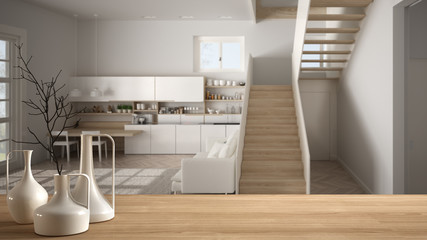 Wooden table top or shelf with minimalistic modern vases over blurred modern white kitchen with wooden details and parquet floor, minimalist architecture interior design