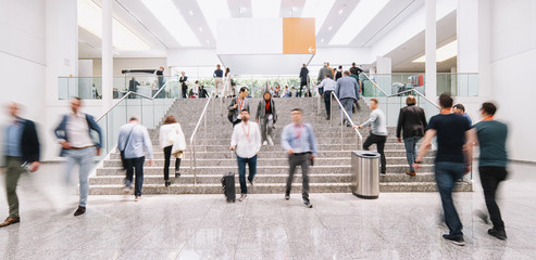 blurred business people at a trade fair