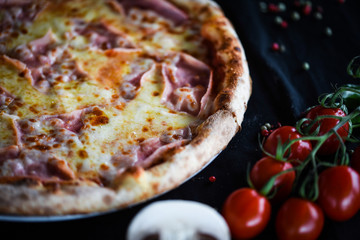 tasty italian pizza with prosciutto & cheese