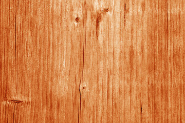 Wooden board texture in orange tone.