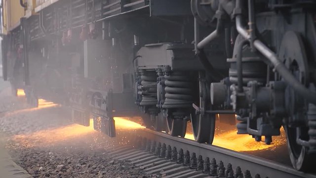 from under the car of a train sparks