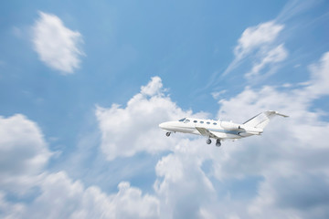 Fototapeta na wymiar Private jet is flying